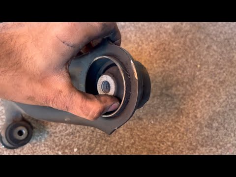 Видео: Как заменить нижний рычаг подвески - VW Tiguan - Golf - VAG