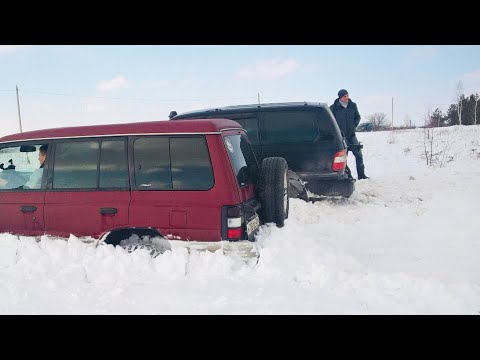 Видео: Битва в снегу: Паджеро и Крузак...