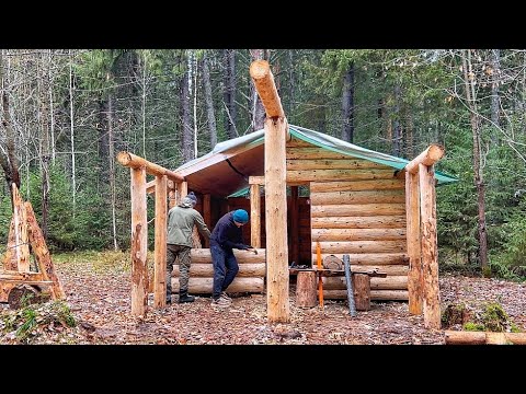 Видео: СТРОИМ БОЛЬШУЮ ХИЖИНУ- ЗАКРЫВАЕМ ПЕРЕДНЮЮ СТЕНУ БРЕВНАМИ!