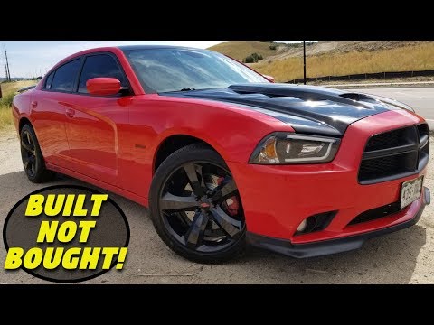 Видео: 620+ л.с., полноприводный зверь! — Dodge Charger R/T 2014 года (список модификаций, динамометриче...