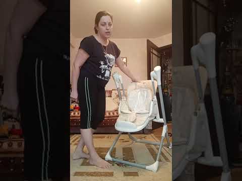 Видео: Стульчик для кормления babyton 2 в 1 с качелями