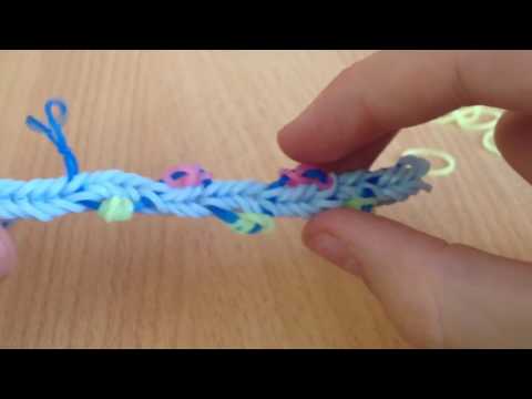 Видео: Браслет цветущая лиана из резинок на крючке и рогатке