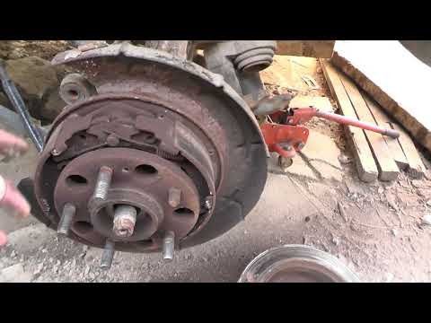 Видео: Kia Sportage 2 4WD Ремонт задних тормозных механизмов ч1