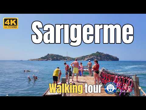 Видео: Пешеходная экскурсия по пляжу Сарыгерме — отмеченные Голубым флагом пески, природный парк и