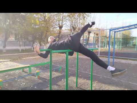 Видео: Растяжка на брусьях - видеоурок