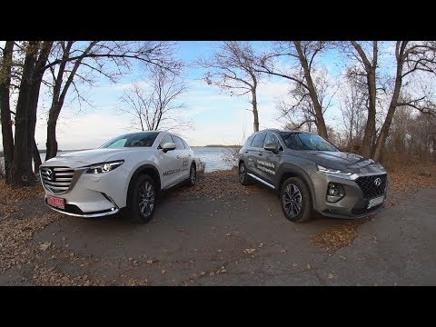 Видео: Новый Hyundai Santa FE против Mazda CX 9
