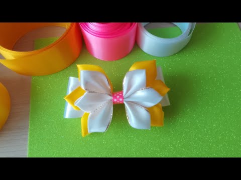 Видео: This bow is made of satin ribbons. Этот бантик сделан из атласных лент.