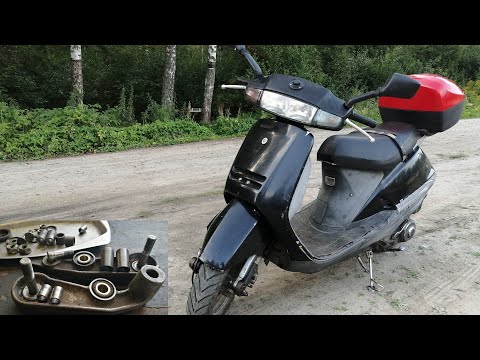 Видео: Honda Lead 90: Ремонт рычажной подвески