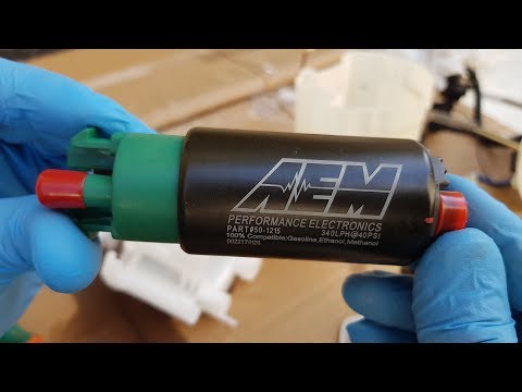 Видео: Установка топливного тюнинг насоса - AEM 340LPH Fuel pump 50-1215 installation on Subaru Legacy