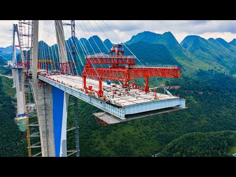 Видео: Китайцы построили мост-небоскреб