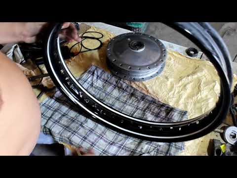 Видео: Устанавливаем спицы и резину на колеса мотоцикла  К-750