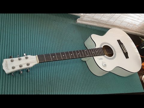 Видео: Акустическая гитара Elitaro. Ремонт.