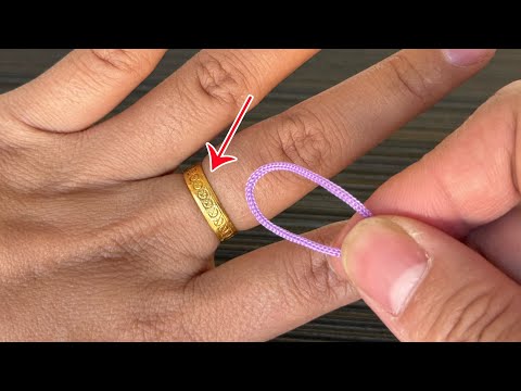Видео: "Кольцо застряло на пальце? Используйте эту нитку, чтобы легко снять!"