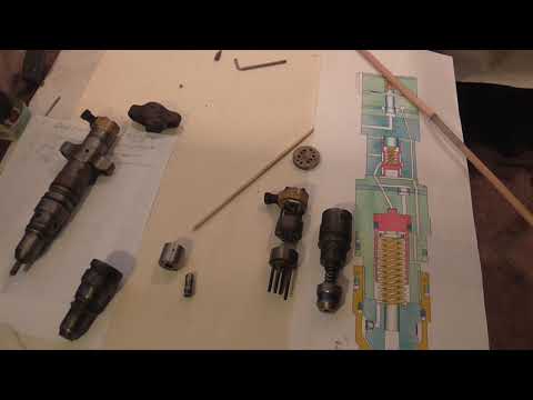 Видео: Ремонт насос-форсунок Катарпиллер Heui C7/C9.