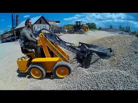 Видео: Обзор работы с челюстным ковшом Мини погрузчик MultiTractor