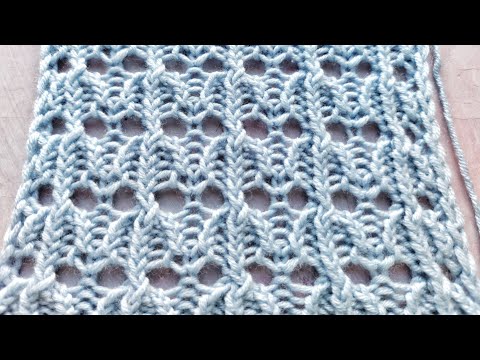 Видео: Ажурный узор спицами на основе резинки со скрещенными петлями