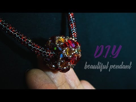 Видео: Кулон из бисера и биконусов.DIY. Making pendant of beads and beads.